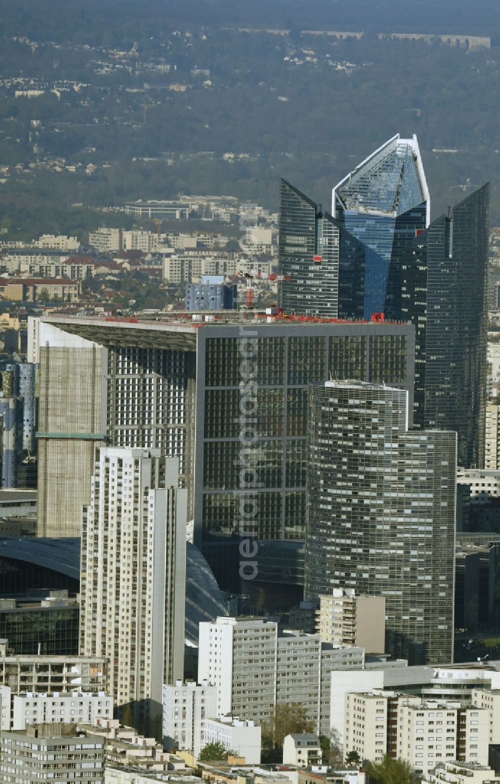 Aerial image Paris Courbevoie - Office building Grande Arche in the business quarter of highrise buildings La Defense in Paris in Ile-de-France, France. It is home to the ministry of commerce and traffic, to offices and the human rights association