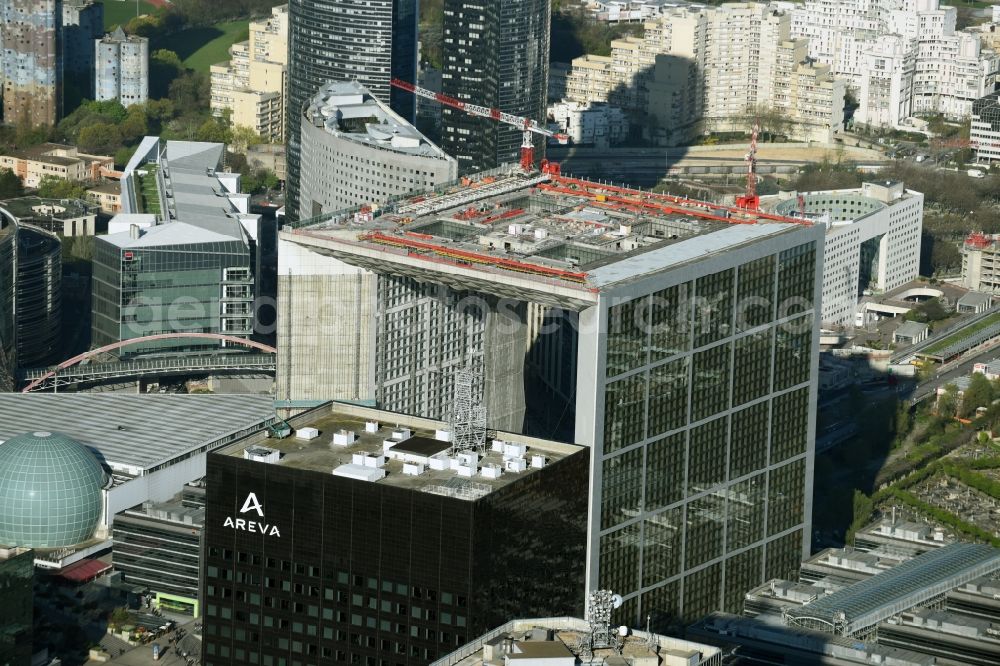 Paris from above - Office building Grande Arche and skyscraper Tour Areva in the business quarter of highrise buildings La Défense in Paris in Ile-de-France, France. It is home to the ministry of commerce and traffic, to offices and the human rights association