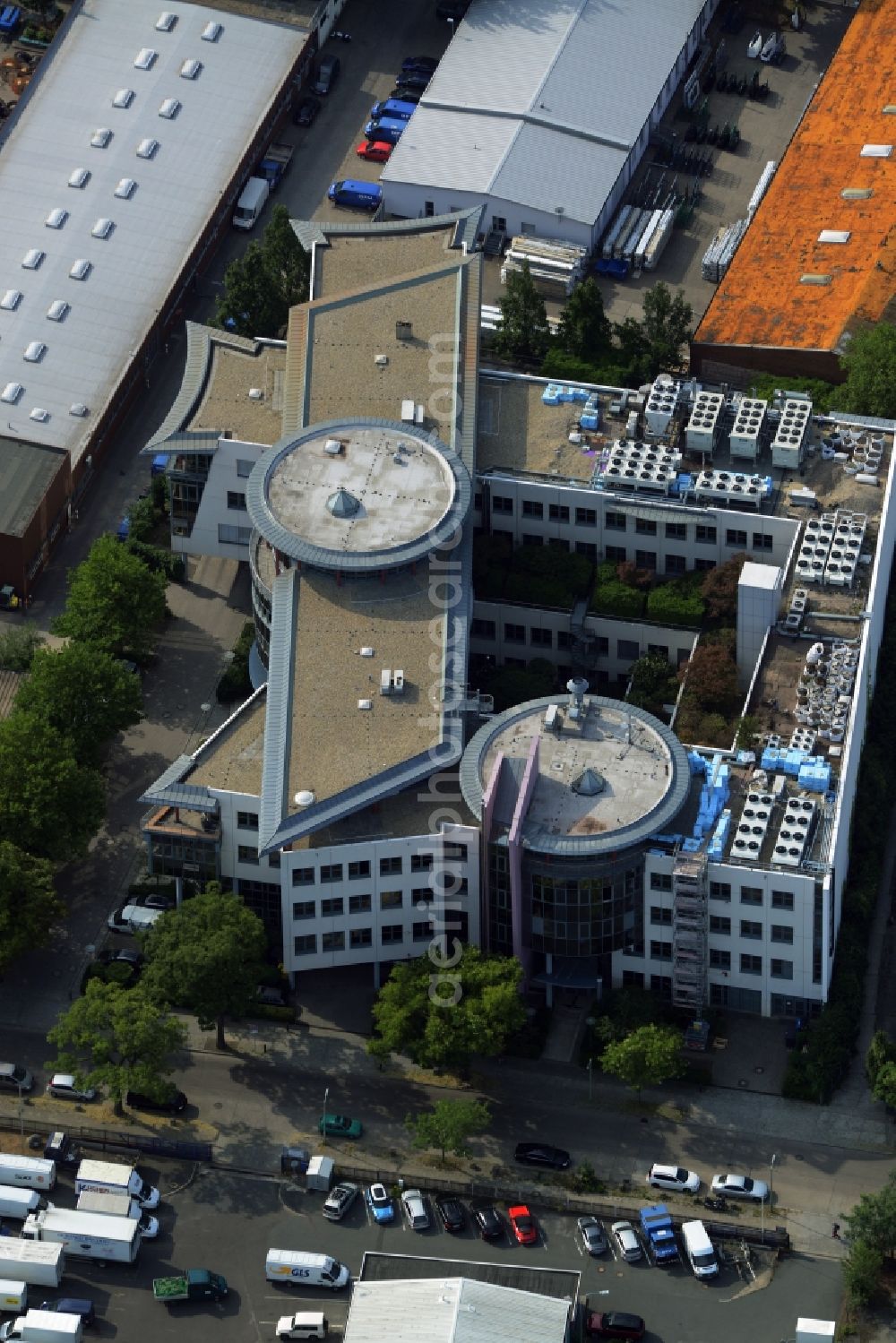 Berlin from above - Office building of Infopark on Kitzingstrasse in the Marienfelde part of Berlin in Germany. The building with its round elements and glass facades is located in a commerce and industrial area