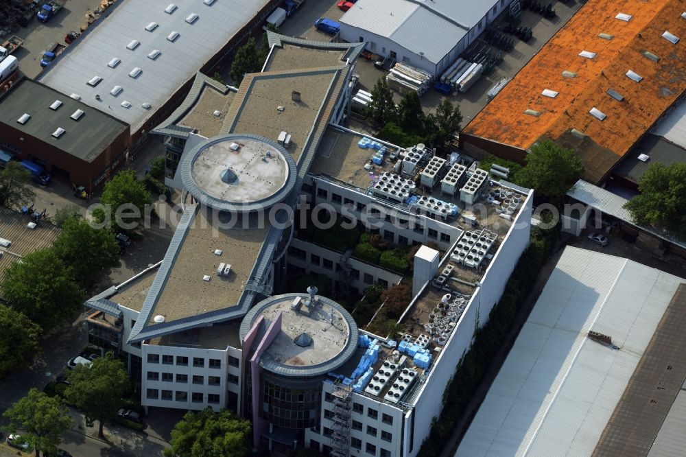 Berlin from the bird's eye view: Office building of Infopark on Kitzingstrasse in the Marienfelde part of Berlin in Germany. The building with its round elements and glass facades is located in a commerce and industrial area