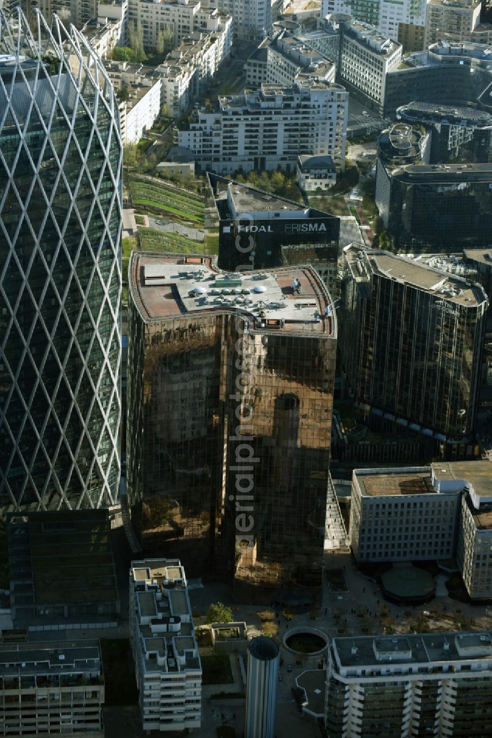 Aerial photograph Paris - Office building Tour Manhattan amidst an office and business building block in the highrise quarter La Defense in Paris in Ile-de-France, France. Tour Manhattan has a golden and reflective front