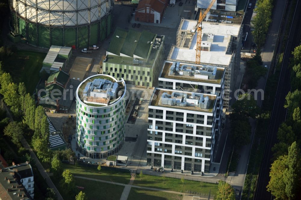 Berlin from the bird's eye view: Office and research buildings on EUREF-Campus in the Schoeneberg part of Berlin in Germany. The architectural distinct buildings on the traditional and historic industrial site at the Gasometer of Berlin are used as event locations, offices and residential buildings