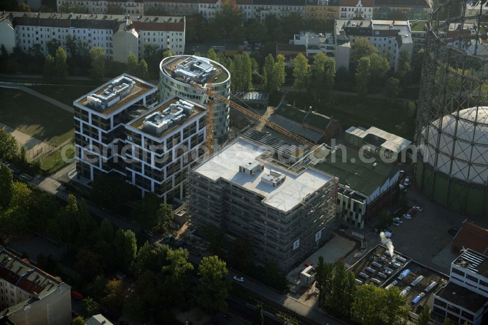 Berlin from the bird's eye view: Office and research buildings on EUREF-Campus in the Schoeneberg part of Berlin in Germany. The architectural distinct buildings on the traditional and historic industrial site at the Gasometer of Berlin are used as event locations, offices and residential buildings