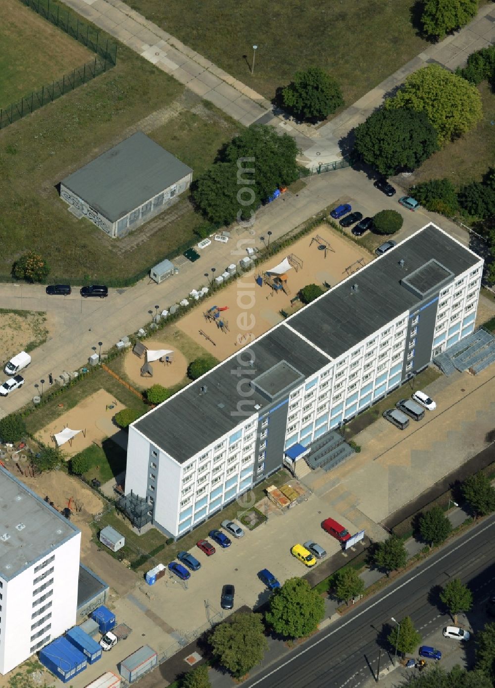 Berlin from the bird's eye view: Office building of the Sportforum Hohenschoenhausen in the Alt-Hohenschoenhausen part of the district of Lichtenberg in Berlin in Germany. The office building with the playgrounds is located on Konrad-Wolf-Strasse