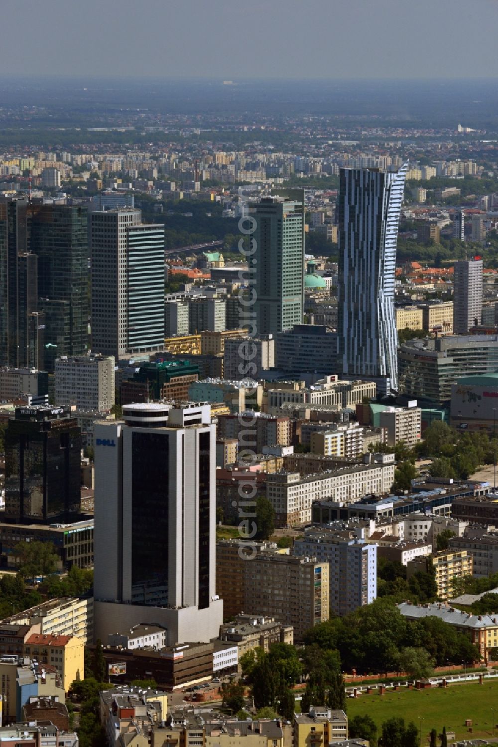 Aerial photograph Warschau - Office tower Millennium Plaza in downtown Warsaw in Poland. In its lower floors there is a shopping mall. The high rise building was completed in 1999 and is located in the city center. It is located a little further away from the other downtown office towers and towers above the surrounding post-war buildings. Main tenant and name giving company was the Millenium bank. One of its main tenants today is the IT company Dell, whose logo is on its upper floors, very well visible from afar. It is 112m high, including antenna it stands at 124m