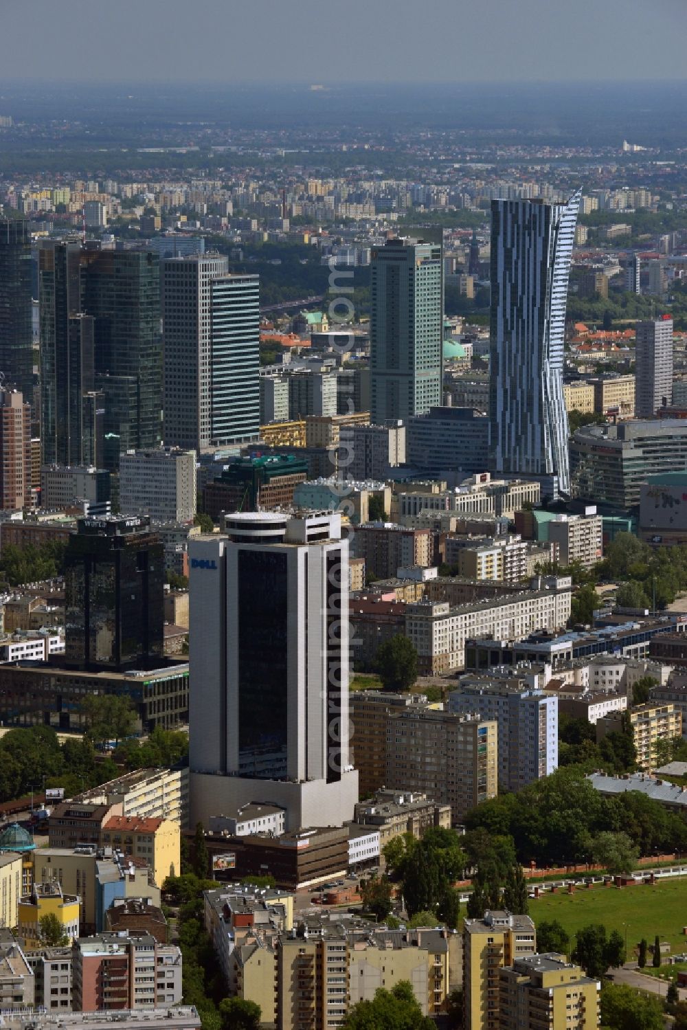 Warschau from above - Office tower Millennium Plaza in downtown Warsaw in Poland. In its lower floors there is a shopping mall. The high rise building was completed in 1999 and is located in the city center. It is located a little further away from the other downtown office towers and towers above the surrounding post-war buildings. Main tenant and name giving company was the Millenium bank. One of its main tenants today is the IT company Dell, whose logo is on its upper floors, very well visible from afar. It is 112m high, including antenna it stands at 124m