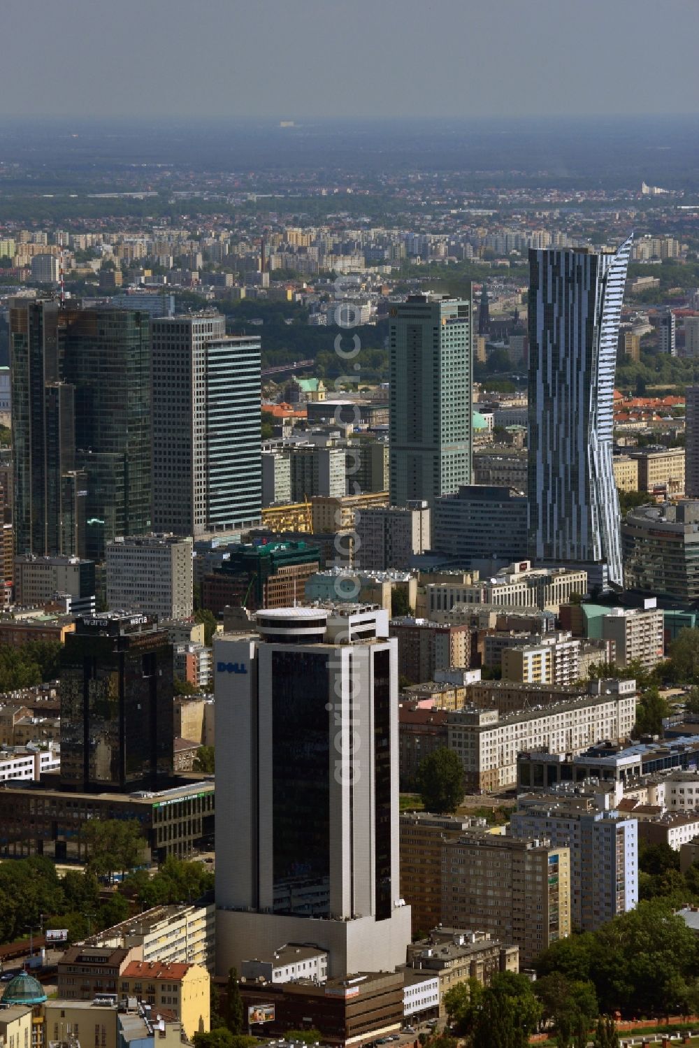 Warschau from the bird's eye view: Office tower Millennium Plaza in downtown Warsaw in Poland. In its lower floors there is a shopping mall. The high rise building was completed in 1999 and is located in the city center. It is located a little further away from the other downtown office towers and towers above the surrounding post-war buildings. Main tenant and name giving company was the Millenium bank. One of its main tenants today is the IT company Dell, whose logo is on its upper floors, very well visible from afar. It is 112m high, including antenna it stands at 124m