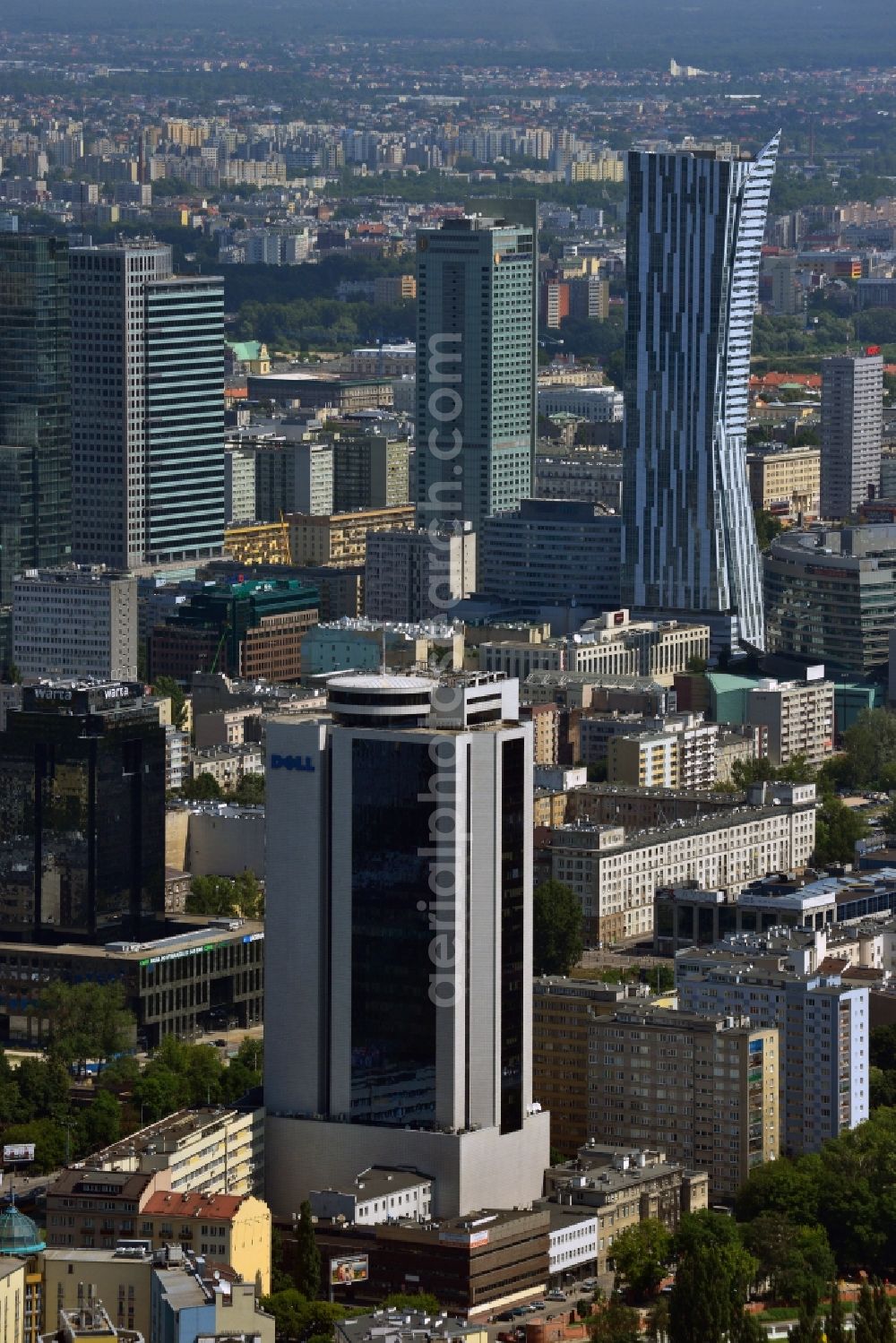 Aerial image Warschau - Office tower Millennium Plaza in downtown Warsaw in Poland. In its lower floors there is a shopping mall. The high rise building was completed in 1999 and is located in the city center. It is located a little further away from the other downtown office towers and towers above the surrounding post-war buildings. Main tenant and name giving company was the Millenium bank. One of its main tenants today is the IT company Dell, whose logo is on its upper floors, very well visible from afar. It is 112m high, including antenna it stands at 124m