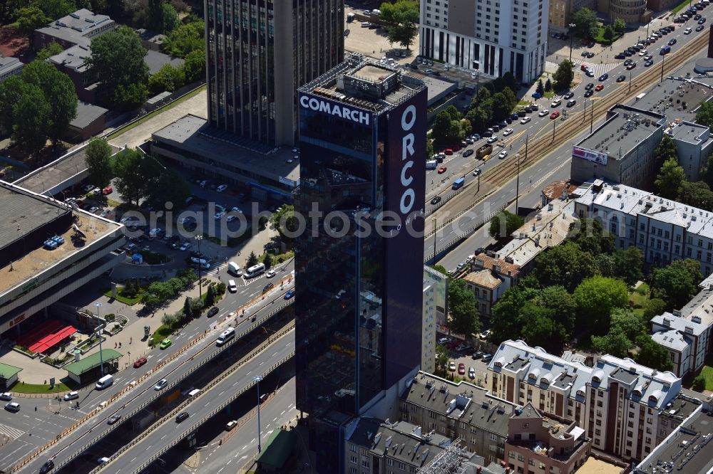 Warschau from above - Office tower ORCO Tower in the Ochota district in downtown Warsaw in Poland. Owner of the high rise building with its distinct dark glas facade is the ORCO Property Group. It was completed in 1996, built in the style of post-modern US-skyscrapers. It is 115m high with 27 floors. It was refurbished in 2008 and the ORCO writing was put on its side. Main tenant is the IT company Comarch, whose logo was also put on the roof. The office tower Oxford Tower is visible in the background