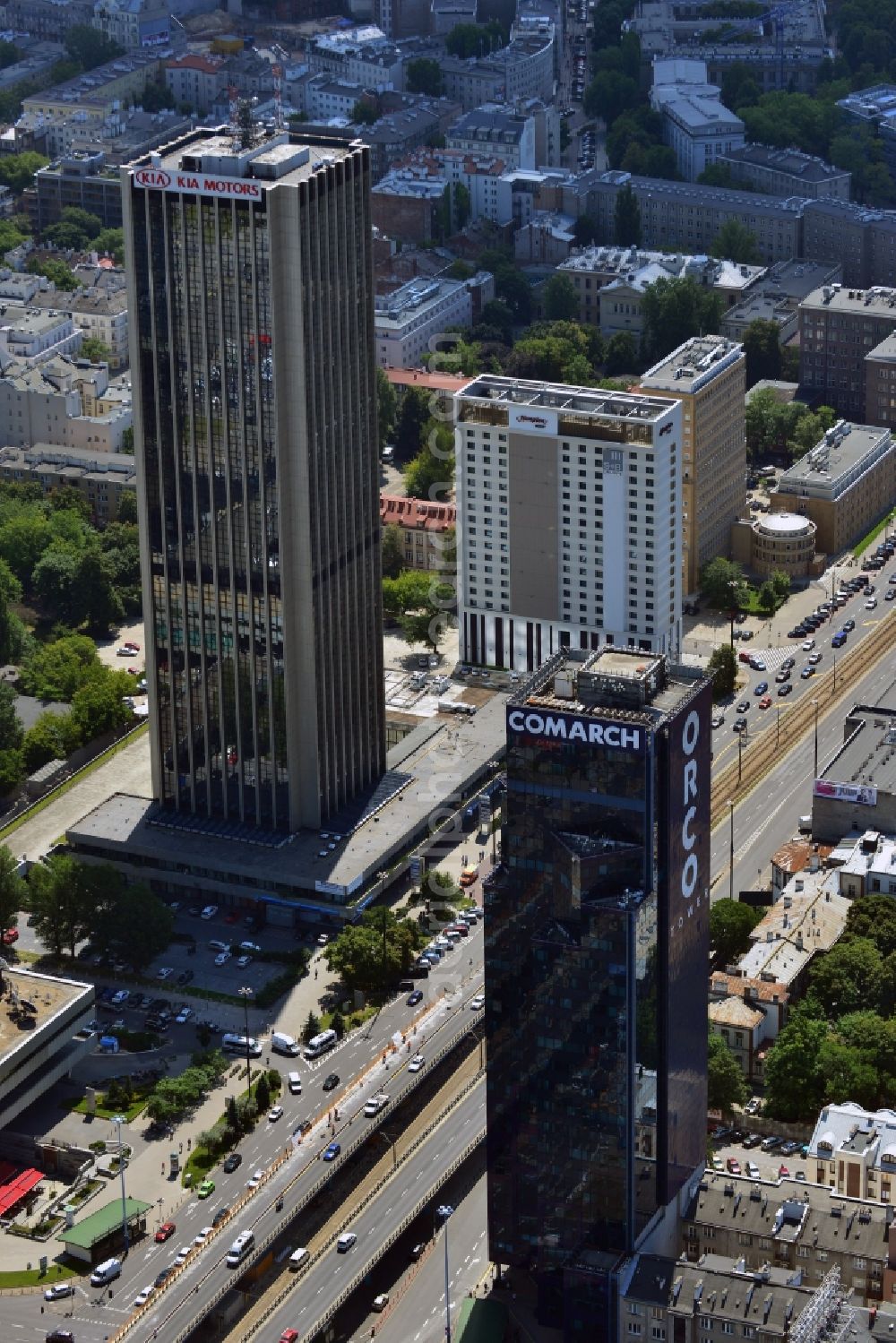 Aerial photograph Warschau - Office tower ORCO Tower in the Ochota district in downtown Warsaw in Poland. Owner of the high rise building with its distinct dark glas facade is the ORCO Property Group. It was completed in 1996, built in the style of post-modern US-skyscrapers. It is 115m high with 27 floors. It was refurbished in 2008 and the ORCO writing was put on its side. Main tenant is the IT company Comarch, whose logo was also put on the roof. The office tower Oxford Tower is visible in the background