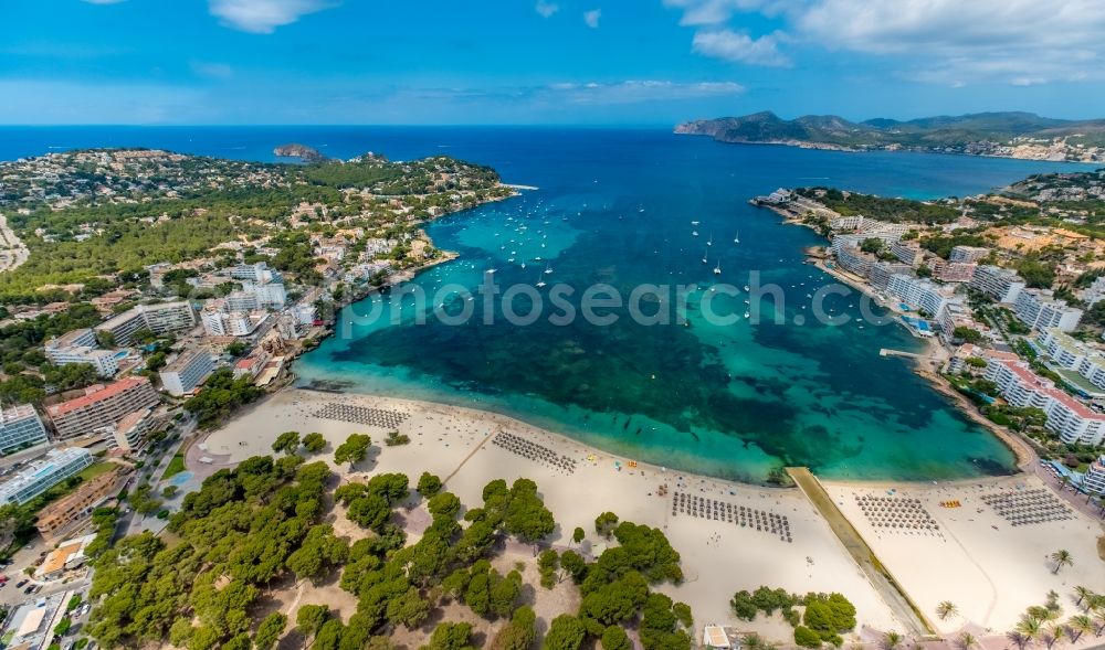 Calvia from above - Water surface at the bay along the sea coast of Balearic Sea on the sandy beach of Platja de Santa Ponca in Calvia in Balearic Islands, Spain