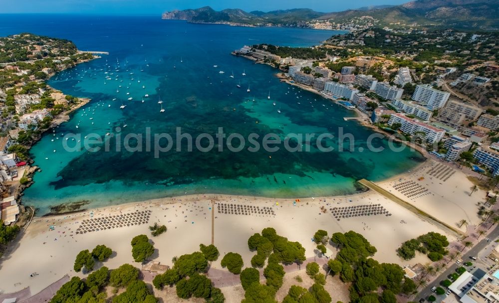 Aerial photograph Calvia - Water surface at the bay along the sea coast of Balearic Sea on the sandy beach of Platja de Santa Ponca in Calvia in Balearic Islands, Spain