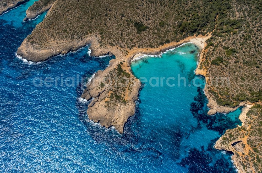 S'Estany d'en Mas from the bird's eye view: Water surface at the bay along the sea coast of Bucht Cala Varques in Manacor in Balearic island of Mallorca, Spain