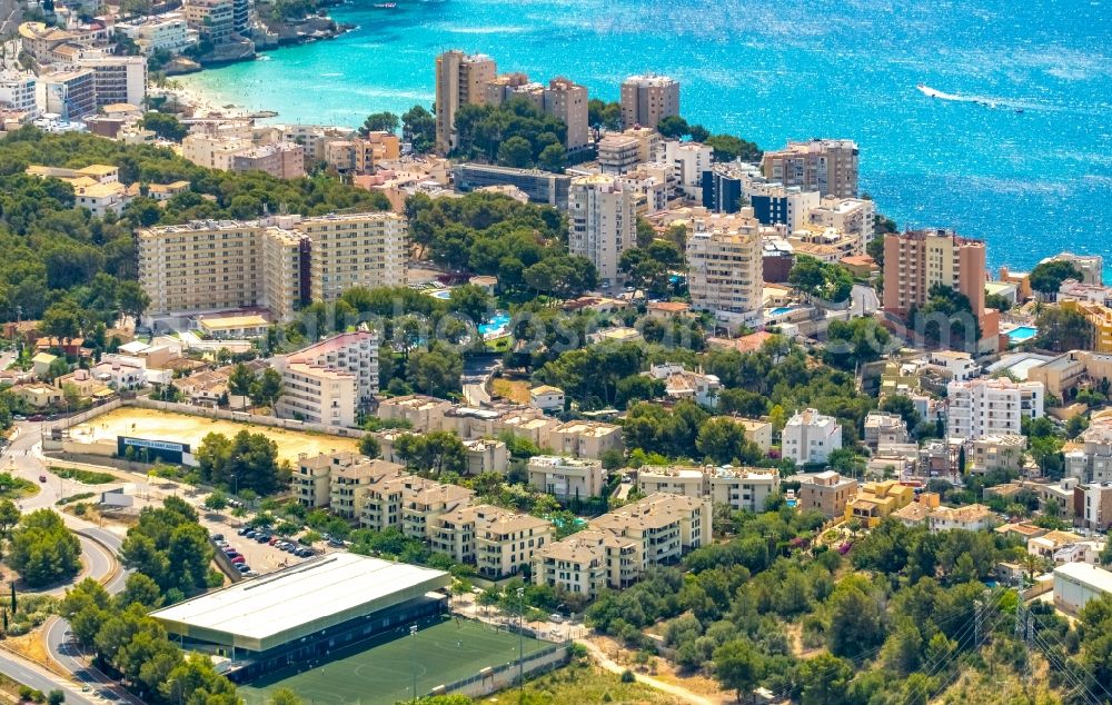 Aerial image Palma - Water surface at the bay along the sea coast Cala Guix - Cala Fornaris overlooking the hotels along the CamA? de GA?nova a Sant AgustA? - Ma-1044 in Palma in Balearic island of Mallorca, Spain