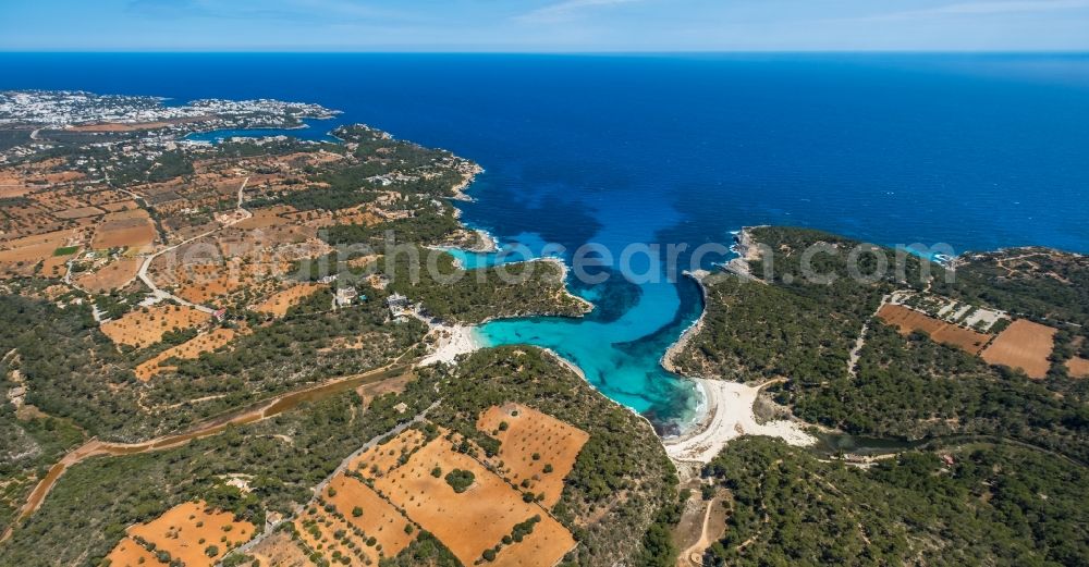 Aerial image Santanyi - Water surface at the bay along the sea coast Cala MondragA? with beaches in Santanyi in Balearic island of Mallorca, Spain