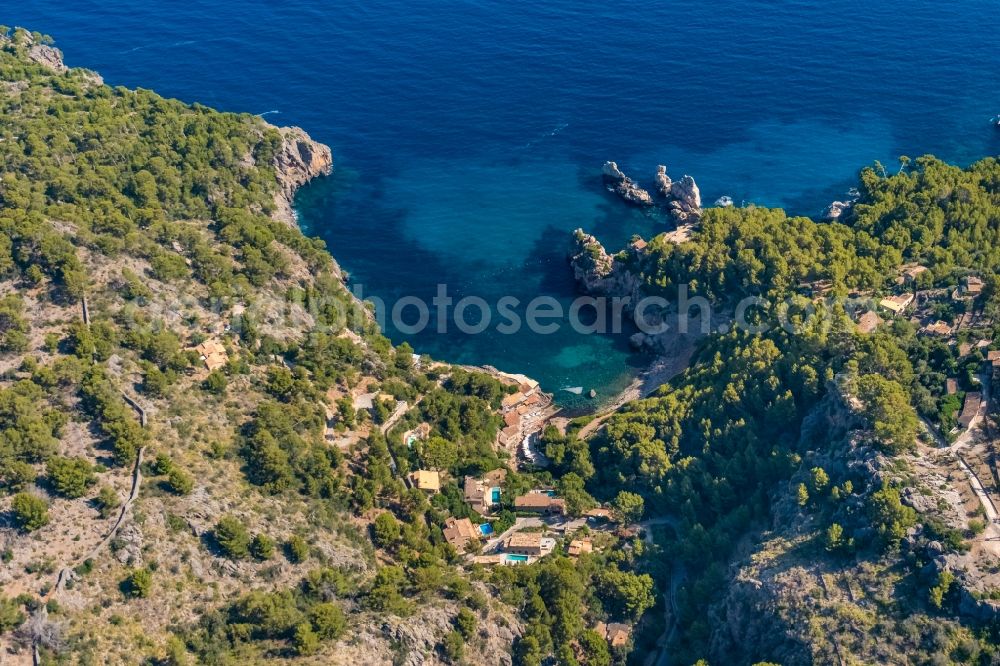 Aerial photograph Deia - Water surface at the bay along the sea coast Cale de Deya in Deia in Balearic island of Mallorca, Spain