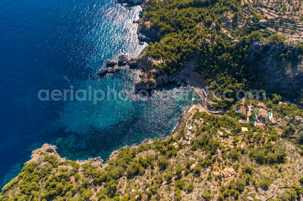 Aerial photograph Deia - Water surface at the bay along the sea coast Cale de Deya in Deia in Balearic island of Mallorca, Spain