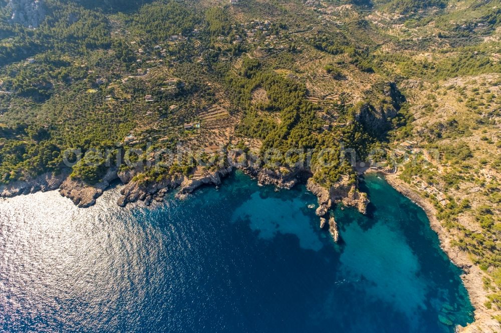 Aerial photograph Deia - Water surface at the bay along the sea coast Cale de Deya in Deia in Balearic island of Mallorca, Spain