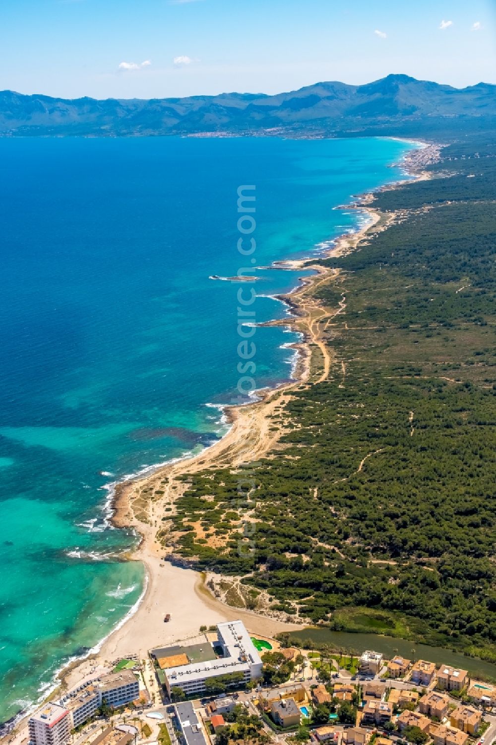 Can Picafort from the bird's eye view: Water surface at the bay along the sea coast in Can Picafort in Balearic island of Mallorca, Spain