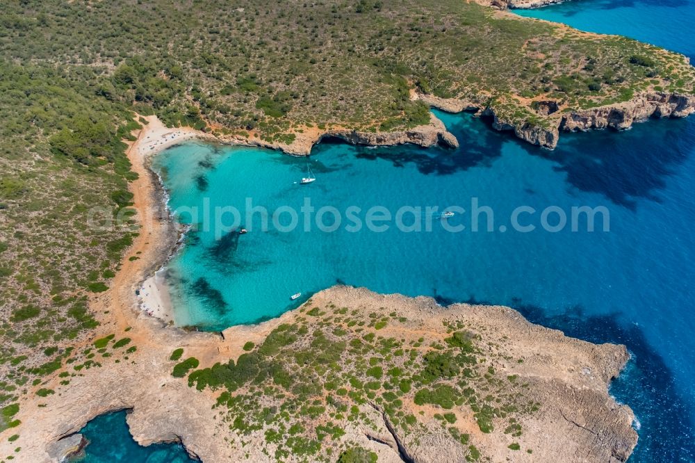 Aerial image Manacor - Water surface at the bay along the sea coast Illes Balears in Manacor in Balearic island of Mallorca, Spain