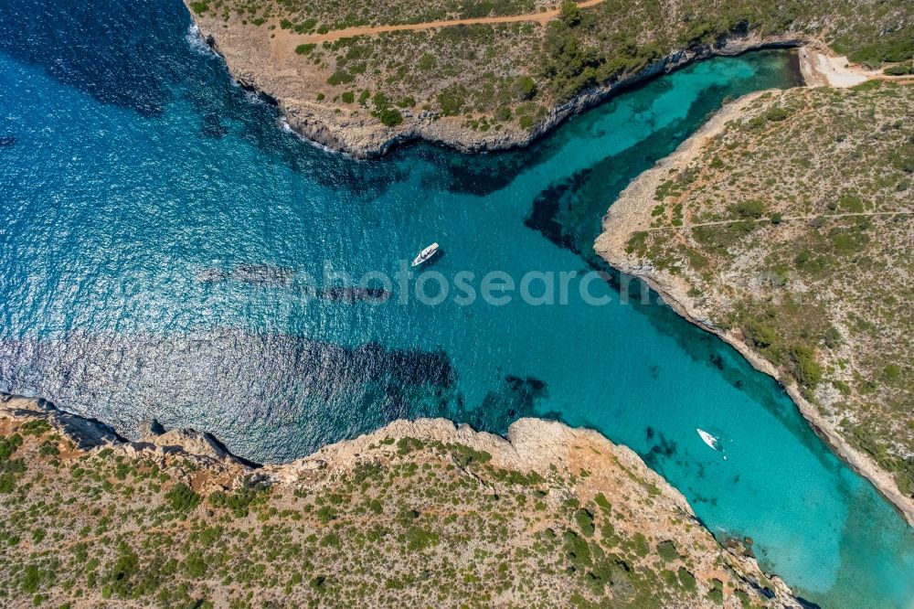 Aerial image Manacor - Water surface at the bay along the sea coast Illes Balears in Manacor in Balearic island of Mallorca, Spain