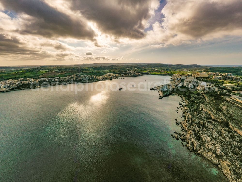 Aerial image San Pawl il-Bahar - Water surface at the bay along the sea coast of the Mediterranean in San Pawl il-Bahar on thge island of Malta