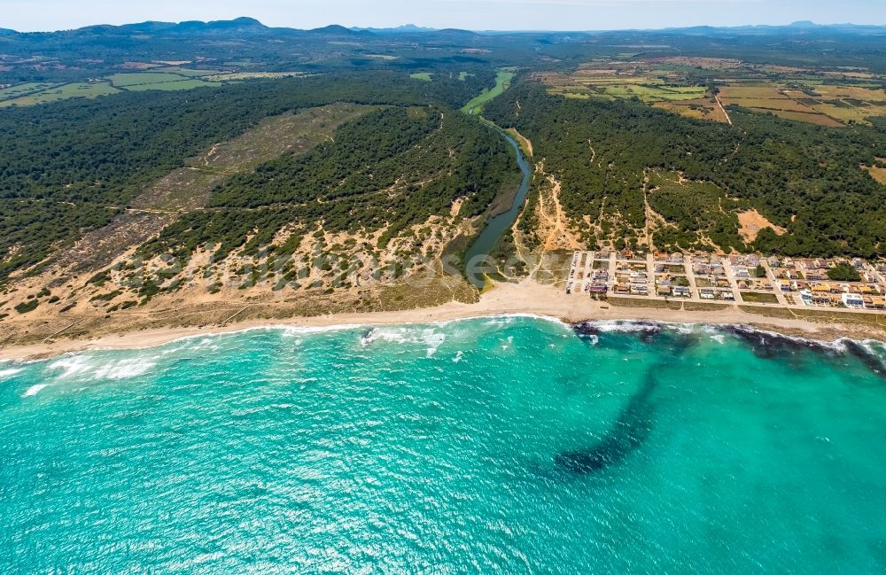 Son Serra de Marina from above - Water surface at the bay along the sea coast on Platja Sa Canova in Son Serra de Marina in Balearic island of Mallorca, Spain