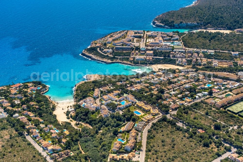 Aerial photograph Cala Mendia - Water surface at the bay along the sea coast with the beaches Platja de Cala Anguila and Playa de Cala Mandia in Cala Mendia in Balearic island of Mallorca, Spain