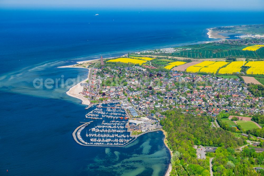 Aerial photograph Laboe - Bay along the sea coast with marina and commercial port on the Kieler Foerde in Laboe in the state Schleswig-Holstein, Germany. The Laboe Baltic Bay Hafen combines maritime trade in the south-western port area