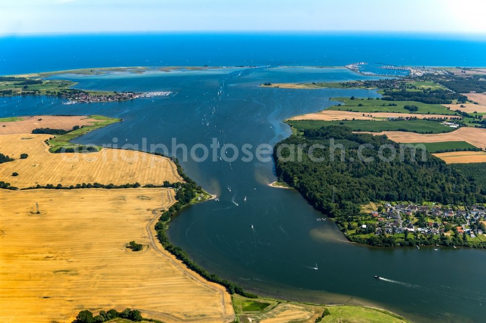 Aerial image Maasholm - Water surface with sailing ships in motion at the Schlei bay along the sea coast of the baltic sea in Maasholm in the state Schleswig-Holstein, Germany