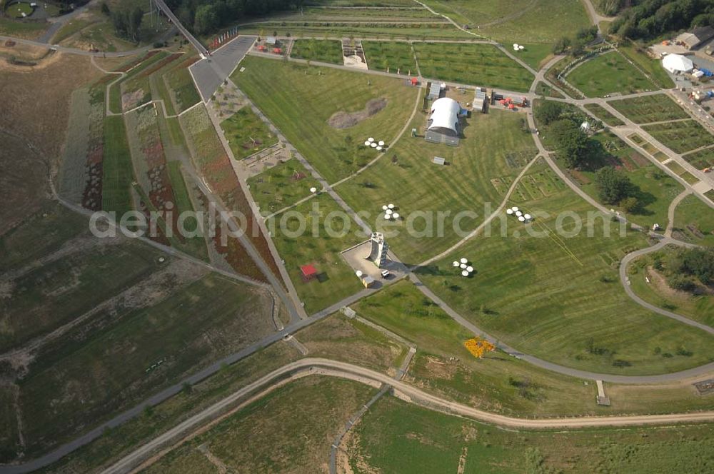 Aerial photograph Ronneburg - . Das 124 Hektar große Areal liegt am Rande des ehemaligen Uranerz-Abbaugebietes der Wismut. Am 27. April 2007 wurde in Ronneburg und in Gera die erste Bundesgartenschau eröffnet, die an zwei Standorten zugleich stattfindet. Sie wird noch bis zum 14. Oktober 2007 andauern.