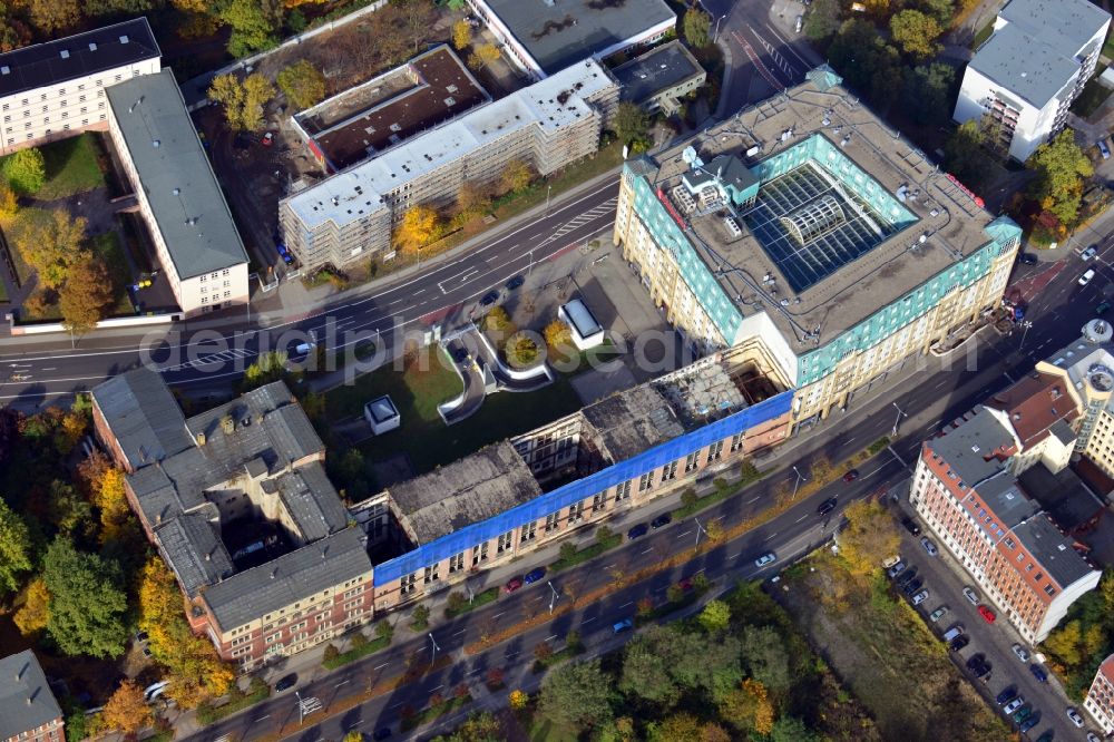 Leipzig from above - View of the abandoned Bugra Messehaus and the Gutenberg Galerie with Ramada Hotel Leipzig City Centre in Leipzig in Saxony. The Gutenberg Gallery at Gutenberg Square is location for gastronomy and commercial areas, offices and conference rooms as well as a hotel of the Ramada brand. The empty Bugra Messehaus at Gerichtsweg hosted the book trade and graphics ( Bugra ) Fair in 1914 and was then used as a convention and exhibition center. The building is currently unused and heavily threatened by decay