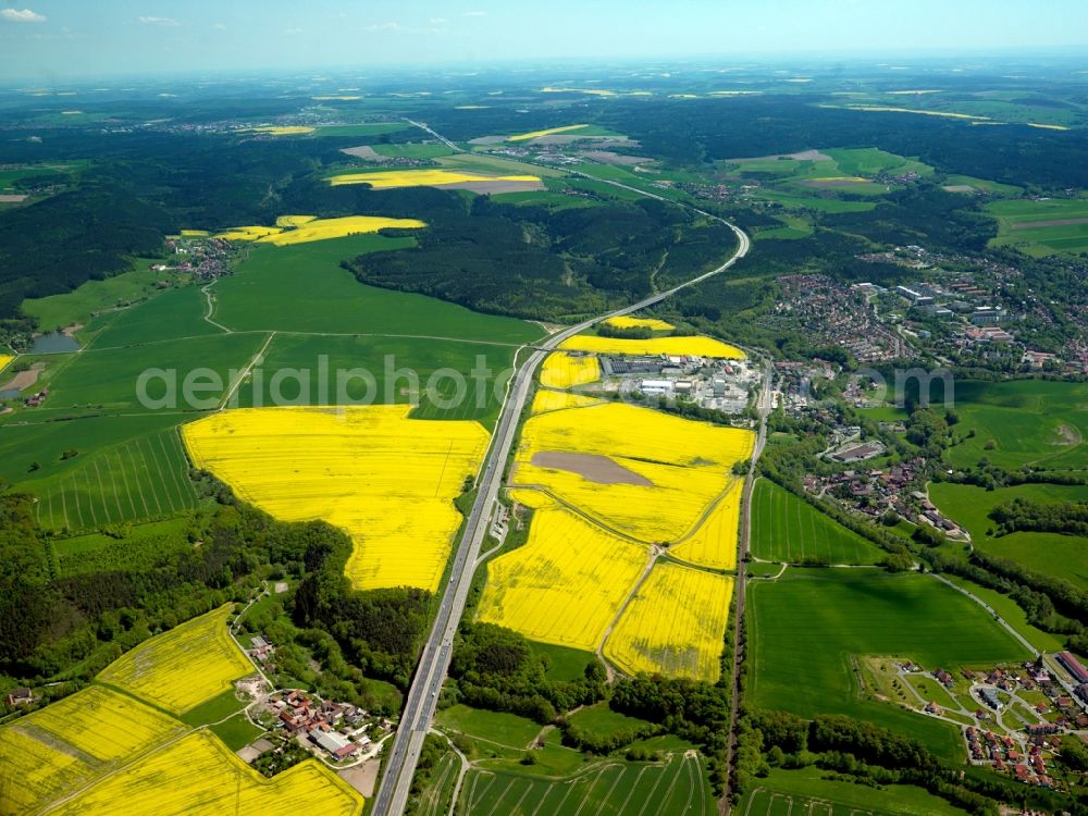 Stadtroda from above - Federal motorway A4 (E40) near Stadtroda in the state of Thuringia. The motorway (autobahn) takes its course in the North of the town, past the industrial area of Stadtroda and between rapeseed fields and forest areas. It runs West to East through the soft hills and agricultural region