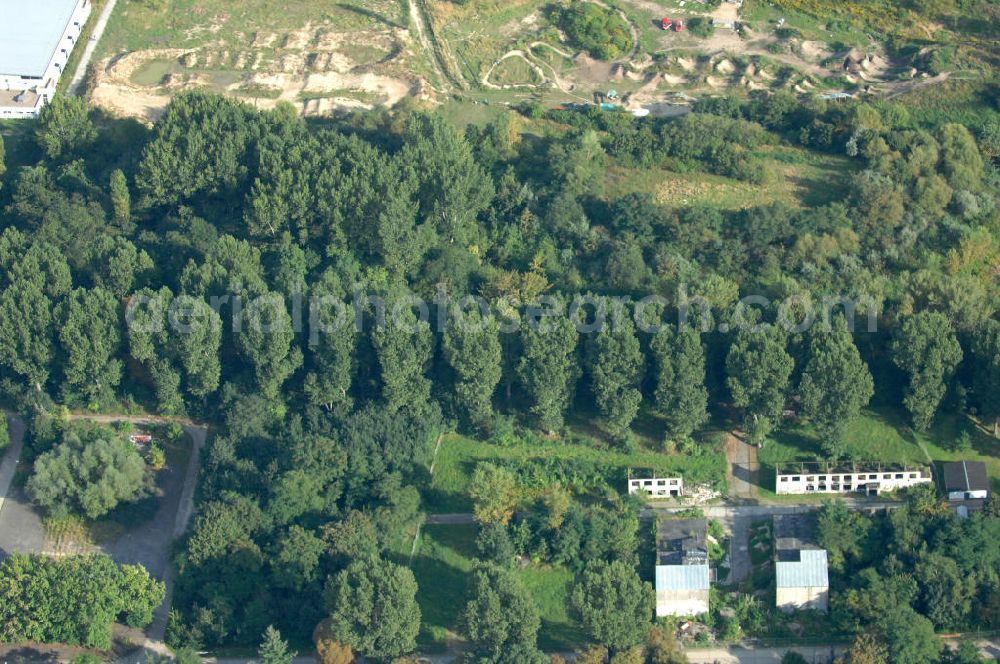 Aerial photograph Berlin - Blick auf das Übungsgelände des Katastrophenschutzes, des THW auf dem Geländes des Technischen Hilfswerk, Ortsverband Berlin Pankow an der Wiltbergstraße neben dem Berliner Ring / Autobahn A 10 / E 55 in Buch. Das Gelände diente ehemals als Hauptsitz der Zivilverteidigung der DDR.