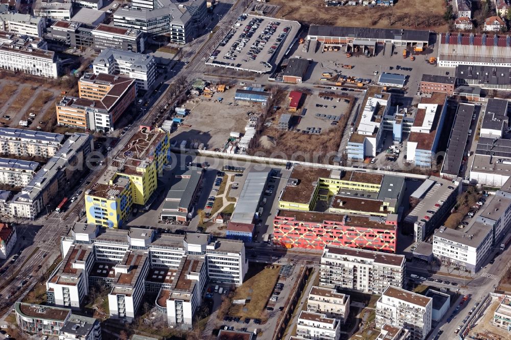 Aerial photograph München - Colorful office buildings on the former EMTEC premises on Kistlerhof area in Munich in Bavaria. One roof with the sculpture garden Heaven 7 of the artist Wolfgang Flatz