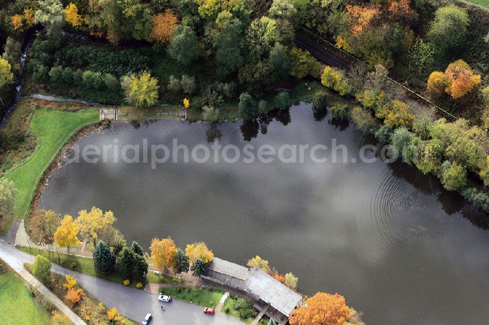 Bad Sulza from above - Brightly colored trees on the banks of the pond Emsenteich in Bad Sulza in Thuringia