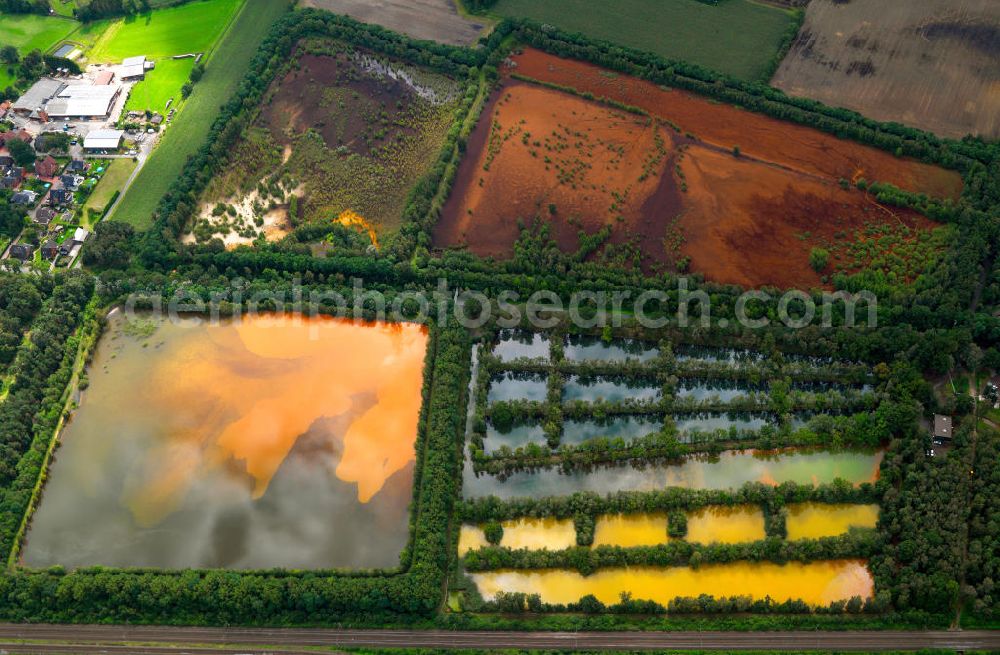 Aerial image Ibbenbüren - Colorful water surface reflection on mineral-rich reservoir in Ibbenbühren in North Rhine-Westphalia