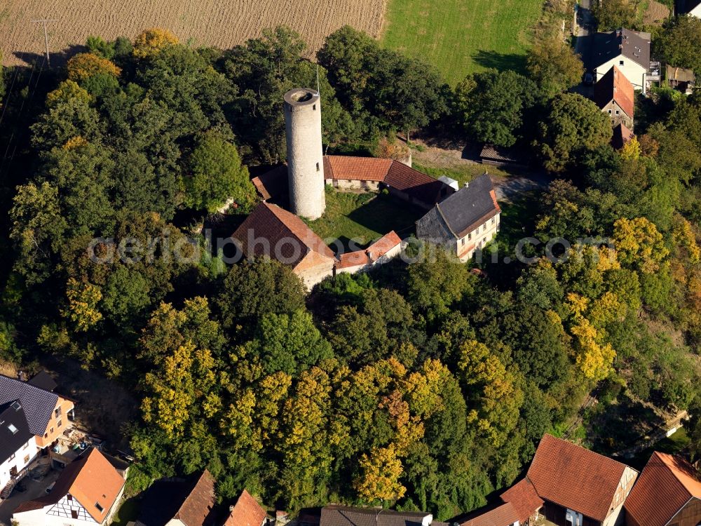 Aerial image Arnstein - Fortress Büchold in the Büchold part of Arnstein in the state of Bavaria. The former high castle with the Roman castle keep, a ditch and cellar is located on a hill between forest and fields. Also called Castle Büchold, the ruins were renovated and the site is Wolfgang Gerberely owned now