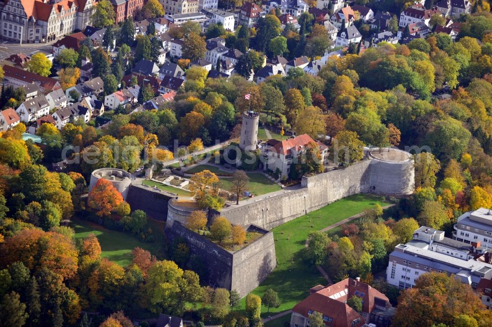 Bielefeld from above - View of the Castle and Fortress Sparrenberg in Bielefeld in the state North Rhine-Westphalia. The Sparrenburg is a restored fortress in the district Mitte of Bielefeld. It is situated on the Sparrenberg in the Teutoburg Forest