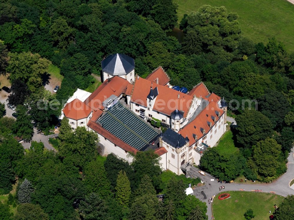 Jagsthausen from above - Castle Jagsthausen in Jagsthausen in the state of Baden-Württemeberg. The castle, also called Old Castle or Götzenburg after Goethes drama Götz von Berlichingen, is one of the seats of the lords of Berlichingen. It is located on a hill in the river Jagst valley and is used for open air festivals