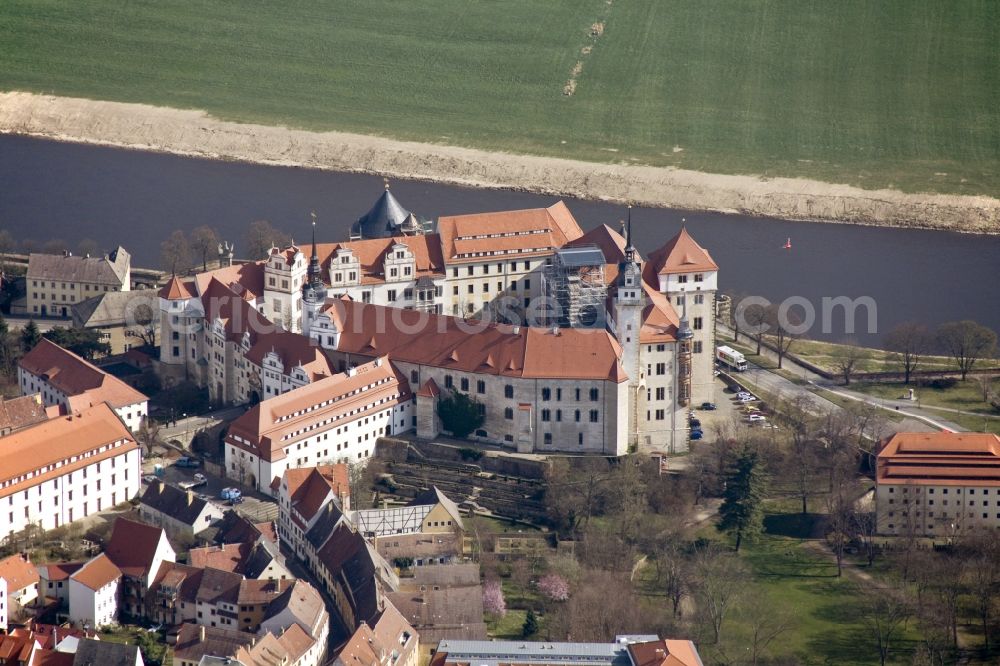 Aerial photograph Torgau - The castle / palace Hartenfels is situated in Torgau close to the river elbe. It belongs to the federal state of Saxony. The construction was startes by Konrad Pflueger and finished by Konrad Krebs during the time of renaissance. The chapell of the castle was the first protestant church in the world and was built by Nikolaus Gromann