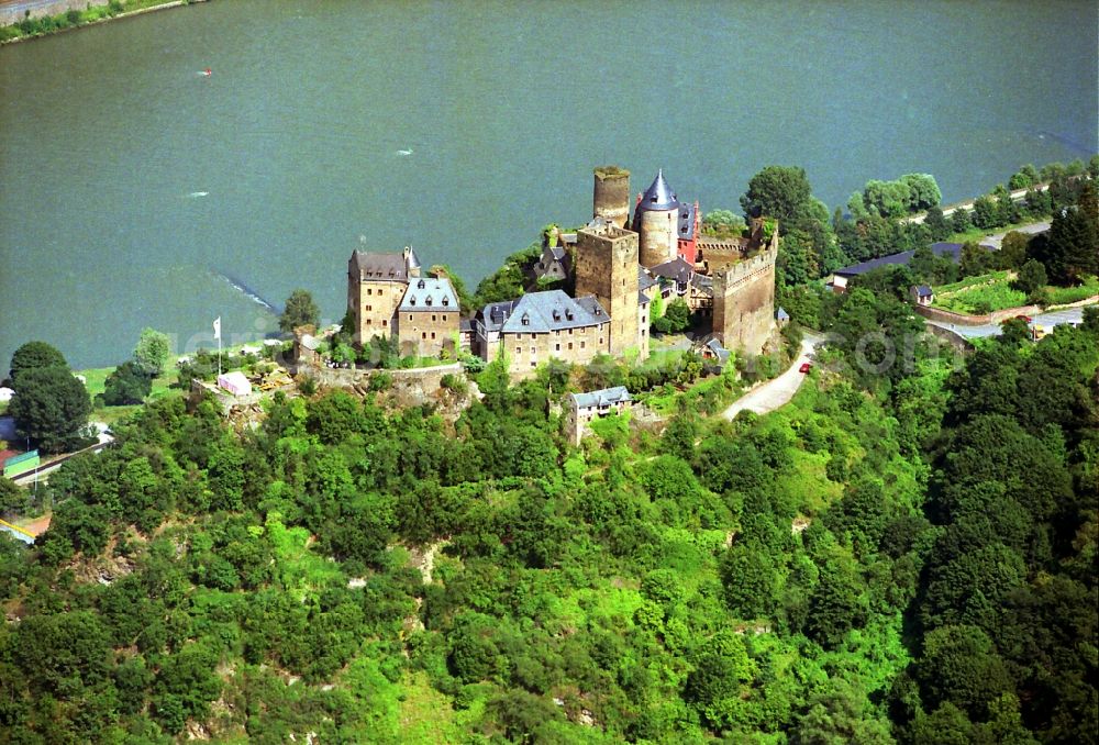 Aerial photograph Oberwesel - The Castle Schoenburg in the Rhine valley Oberwesel in the Rhineland-Palatinate. The castle was built since the 12th Century and is today part of the Kolping youth work and a hostel