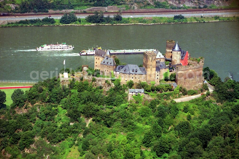 Oberwesel from above - The Castle Schoenburg in the Rhine valley Oberwesel in the Rhineland-Palatinate. The castle was built since the 12th Century and is today part of the Kolping youth work and a hostel