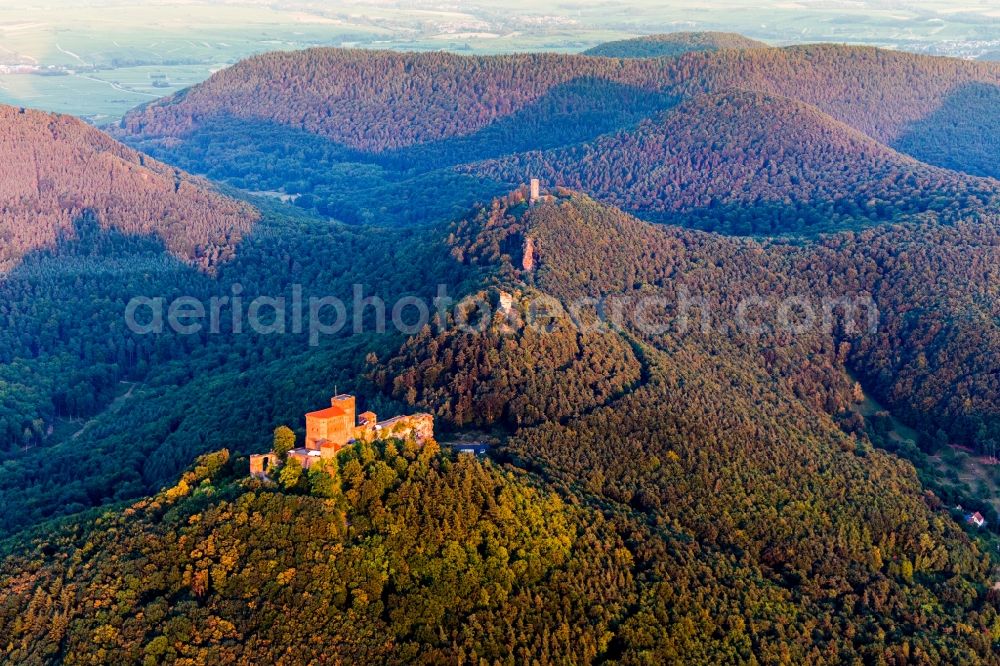 Annweiler am Trifels from above - Castle of Trifels and the former fortresses Anebos and Scharfenberg(Muenz) in morning light above the hills of the Pfaelzerwald in Annweiler am Trifels in the state Rhineland-Palatinate, Germany