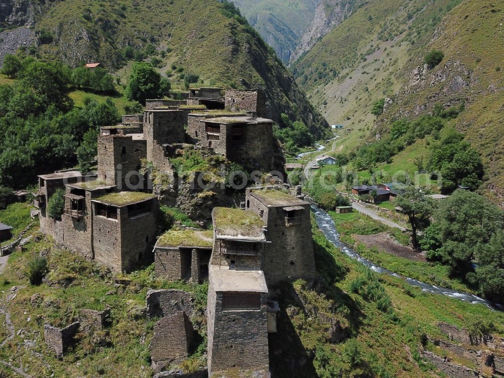 Aerial image Schatili - Castle of the fortress and fortified village in Schatili in Mtskheta-Mtianeti, Georgia