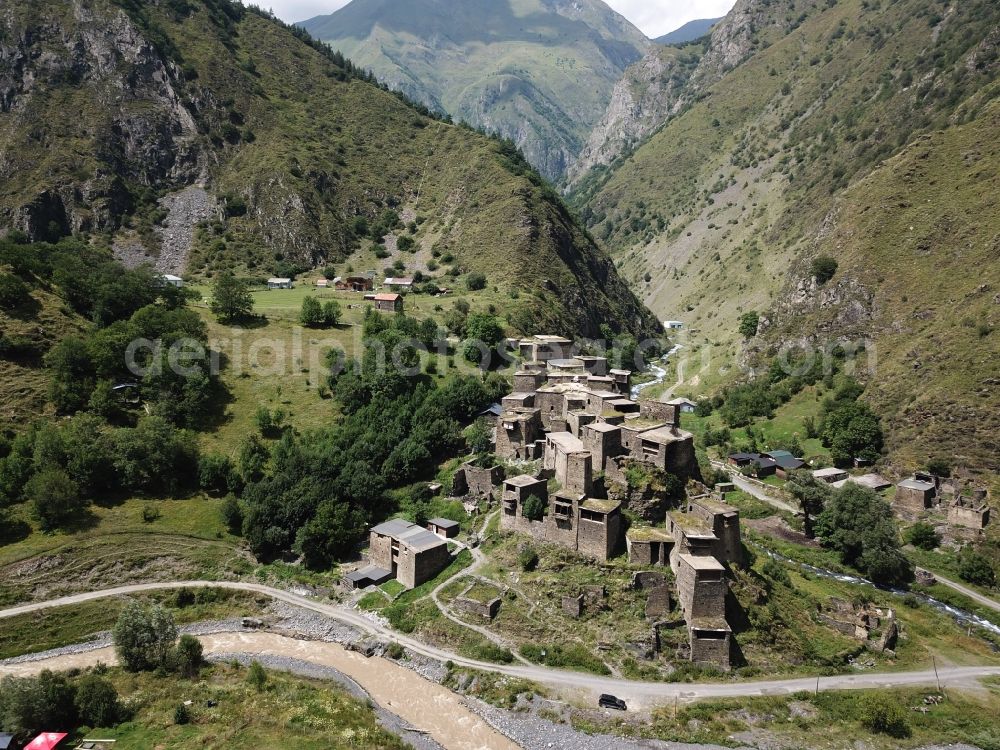 Aerial image Schatili - Castle of the fortress and fortified village in Schatili in Mtskheta-Mtianeti, Georgia