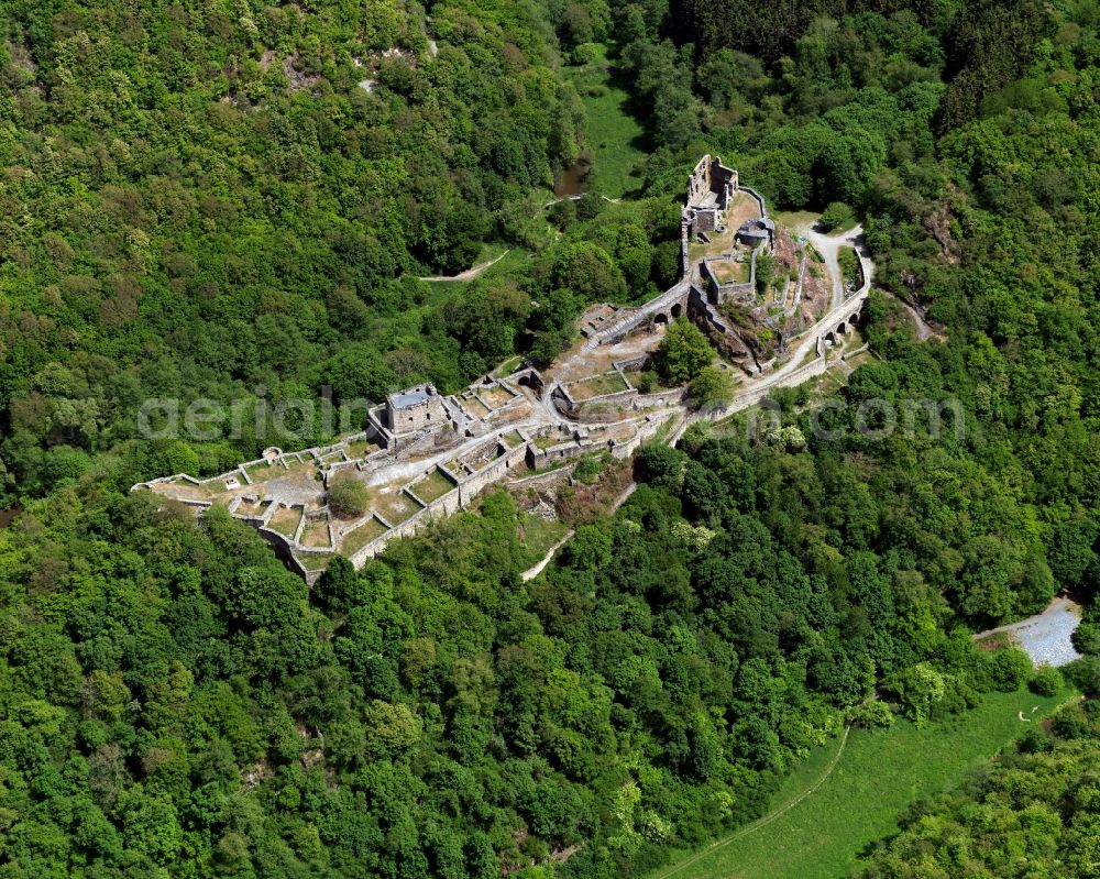 Schneppenbach from the bird's eye view: Ruins of the Schmidtburg near Schneppenbach in the state of Rhineland-Palatinate. The Schmidtburg is a ruined hill castle which is located on a wooded hill in the Hunsrueck region above the Hahnenbach creek valley. Walls and parts of a tower remain