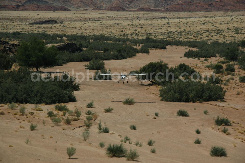 Aerial image Sandfontein - Eine Cessna 182 im Tiefflug im Umland von Sandfontein / Namibia. A Cessna 182 flying low in the surrounding areas of Sandfontein.