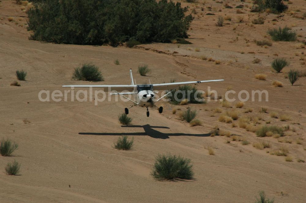 Aerial photograph Sandfontein - Eine Cessna 182 im Tiefflug im Umland von Sandfontein / Namibia. A Cessna 182 flying low in the surrounding areas of Sandfontein.