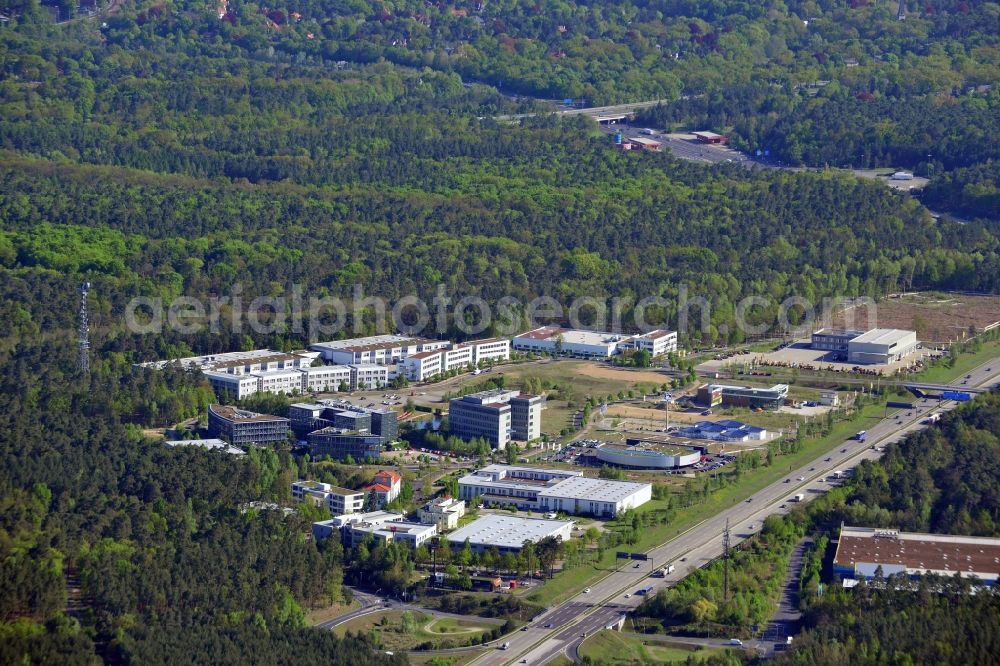 Kleinmachnow from above - Business Campus Europarc Dreilinden in Kleinmachnow in the state Brandenburg. The commercial area with its stores, shopping facilities and business building complexes is located on federal motorway A115 and is surrounded by forest